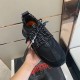 Top-down hand-held view of Versace Chain Reaction black trainer showing lacing and inner lining