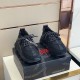 Front view of Versace Chain Reaction black trainers showing patterned laces and mesh toe