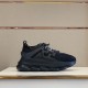 Side profile of Versace Chain Reaction black chunky trainers displayed on shelf