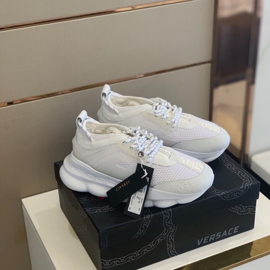 Versace White Trainers Pair on Box Pair of Versace white mesh trainers displayed on top of a black shoe box
