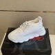 Versace White Trainer Side Profile on Box Side elevated view showing thick chain sole of white Versace trainer