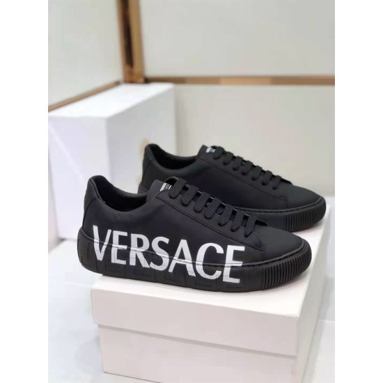 Versace Black Low Top Trainers Three-Quarter Angle in black and white Front-three-quarter view of Versace black leather trainers showing lace unit and side logo in black and white