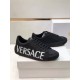 Versace Black Leather Trainers Pair in black and white Pair of Versace black leather low top trainers resting on a white shoe box