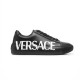 Versace Greca Logo Black Leather Low Top Trainers Side View in black and white Side profile of Versace Greca Logo black leather low top trainers featuring white side lettering