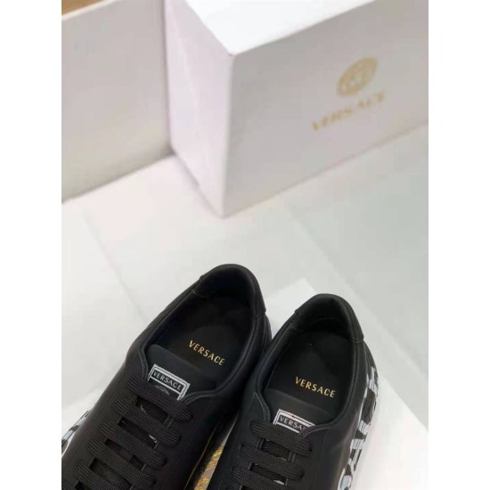 Versace Black Leather Trainers Insole Detail in black and white Top-down view of the opening and gold logo printed on the padded insole of Versace black trainers in black and white