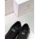 Versace Black Leather Trainers Insole Detail in black and white Top-down view of the opening and gold logo printed on the padded insole of Versace black trainers in black and white