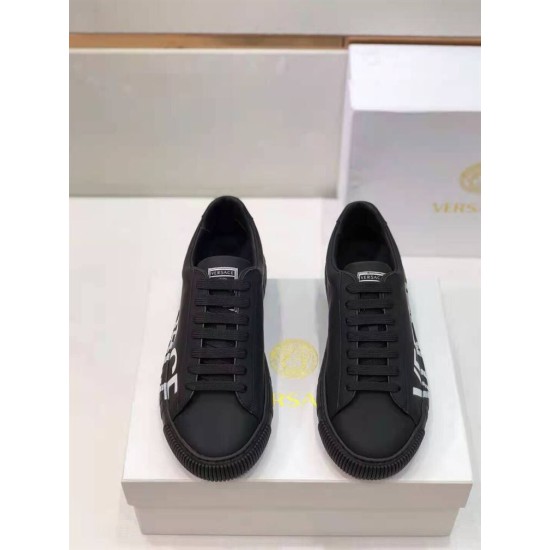 Versace Black Leather Low Top Trainers Front View in black and white Front view of black Versace trainers with flat laces and branded tongue patch in black and white
