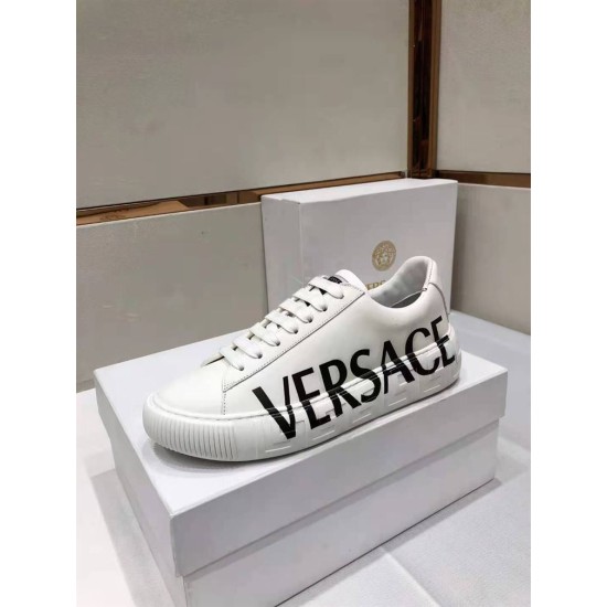 Versace Greca Logo Low Top White Leather Trainers Lateral Profile Lateral side view of white leather Versace trainer with bold lettering