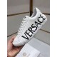 Versace Greca Logo Low Top White Leather Trainers Detail View Handheld view showcasing black printed logo on white Versace trainer