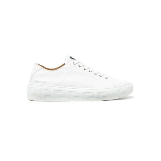Versace White Low Top Trainer Lateral View Clean lateral view of Versace white leather trainer on plain background