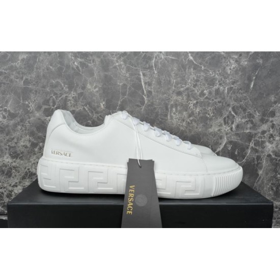 Versace White Trainer Side Profile View Versace white leather low top trainer resting on shoebox with brand tag