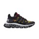 Studio profile of Versace Trigreca black and gold trainer