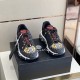 Front view of Versace Trigreca low-top trainers showing toe caps in black and gold