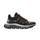 Side view of Versace Trigreca black and gold low-top trainers