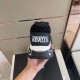 Rear view of black upper showing white Trigreca heel logo badge in black and gold