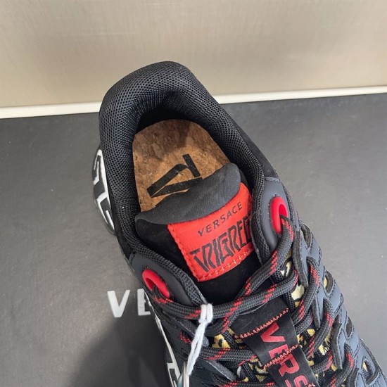 Close-up of cork inner sole and red tongue branding in black and gold