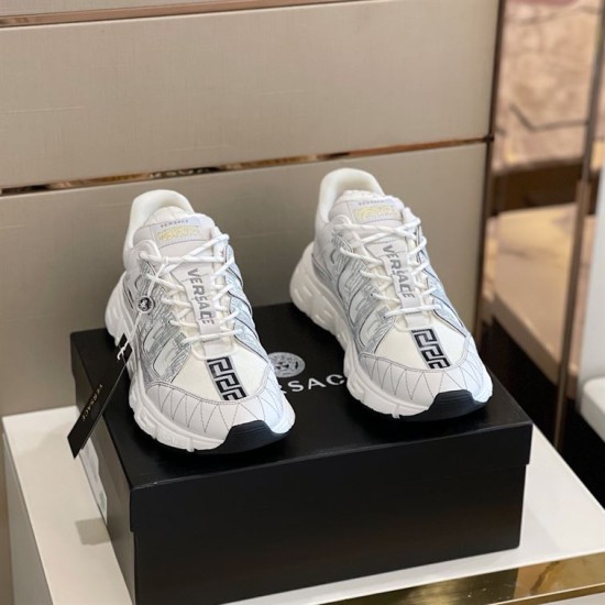 Versace Trigreca White Trainers Pair in white and gold Pair of white Versace Trigreca trainers displayed on black shoe box front view in white and gold