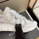 Versace Trigreca Lace Detail in white and gold Close-up of lace closure and lace toggle on white Versace Trigreca trainer in white and gold