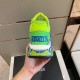 Rear view of the trainer highlighting the green heel tab and Trigreca logo in green and blue