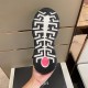 Bottom outsole view showing the black and white Greca tread with a central red insert in green and blue