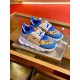 Versace Blue Baroque Chain Reaction Pair Angle View in blue and gold Pair of Versace blue and yellow baroque trainers displayed on a metal tray in blue and gold