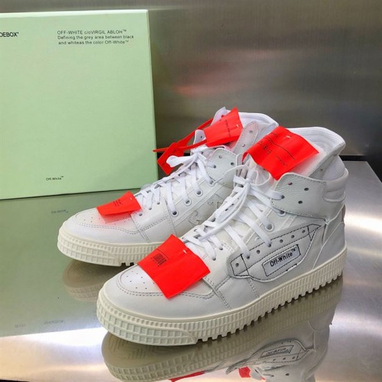Off-White 3.0 Court Leather High-Top Trainers Front Angle Three-quarter front angle of Off-White 3.0 Court white leather high-top trainers with orange tags