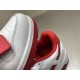 Close-up of padded red lining and perforated toe box on white trainer in off-white and white