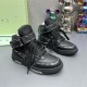 Pair of Off-White High Top Black Leather Trainers displayed from an angled front perspective