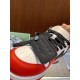Close-up view of black leather zip tie tag on Off-White Out Of Office Ooo Trainers in off-white and red