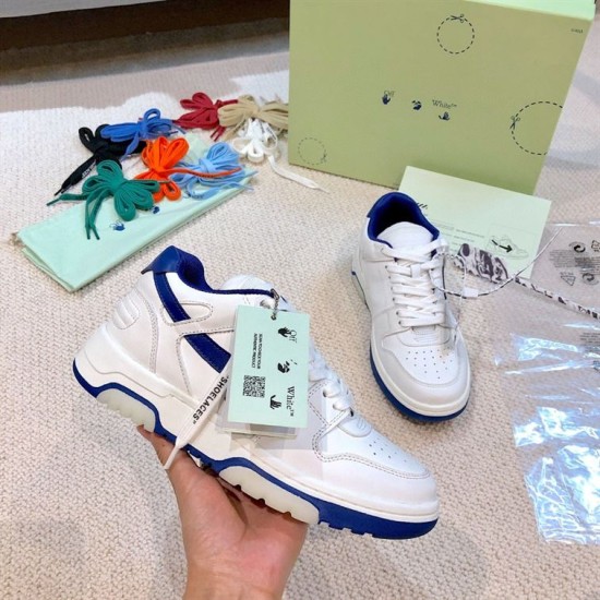 Off-White Out Of Office Leather Trainer Handheld View Hand holding a white and blue Off-White Out Of Office trainer showcasing the side profile and tag