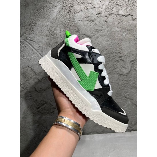 Handheld side view showcasing the textured sole of Off-White Sponge Mid-Top Trainers in off-white and black