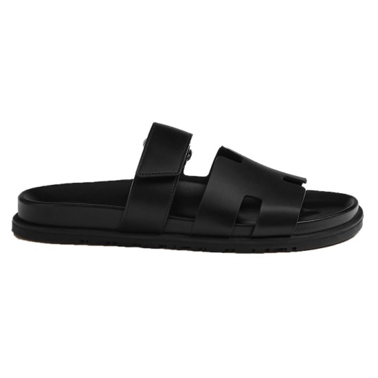 Hermes Chypre black leather sandals side profile Side profile view of Hermes Chypre black leather sandals showing sole contour
