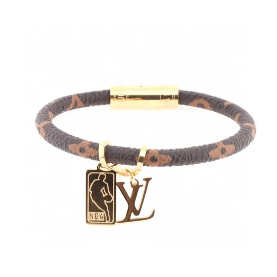 L Men's NBA Leather Bracelet Detail View Angled view of the L Men's NBA Leather Bracelet showing the gold-tone clasp and charms