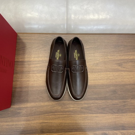 Valentino Men's brown loafers paired together showing top view of v-logo hardware in brown and white