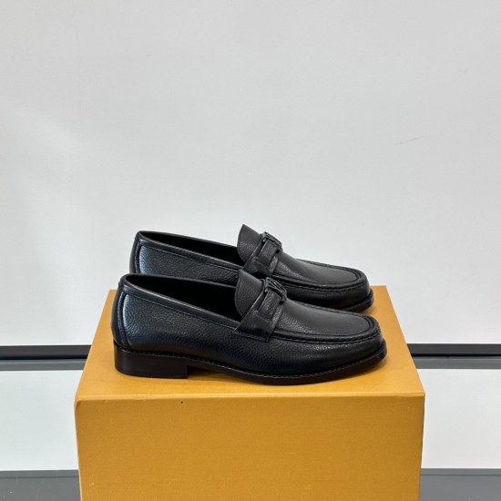 Side profile of L Men's Major Loafers In Black Grain Leather resting on an orange shoe box against a plain backdrop.