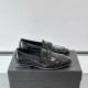 Dolce & Gabbana Men's Black Patent Loafers Side Profile Dolce & Gabbana Men's Black Polished Patent Calfskin Loafers side profile view on box