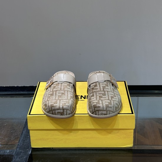 Front view of Fendi beige jacquard logo slip on slippers Front view of the Fendi beige jacquard logo slip on slippers displayed on a yellow box
