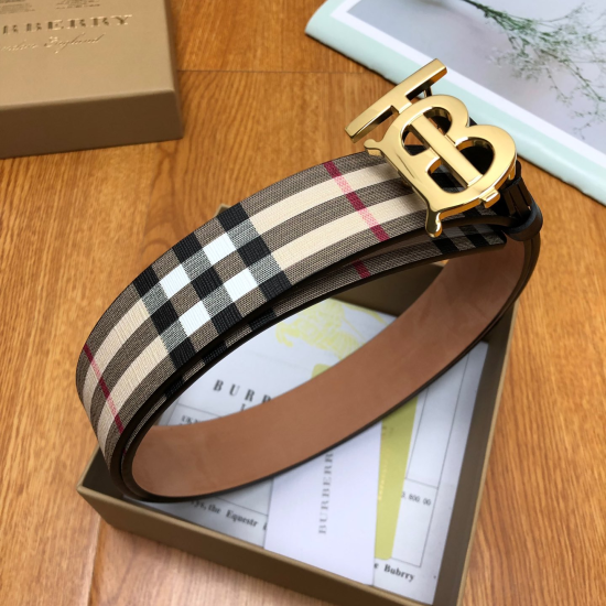 Angled view of Burberry Men's Men Reversible Monogram Motif Vintage Check Belt coiled inside its presentation box