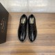 Top view of black Prada Men's Brushed Leather Derby Brogue Shoes Direct top view of black Prada Men's Brushed Leather Derby Brogue Shoes showing lace-up closure