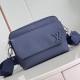 CL Men's Men'sose-up of the L men navy blue messenger bag highlighting the front flap and hardware