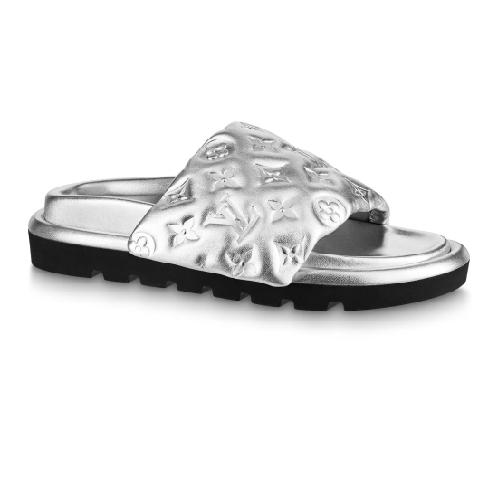 L Silver Pool Pillow Comfort Slides Side Profile in silver and black Side profile view of the L silver Pool Pillow Comfort Slides showcasing the quilted strap and black sole