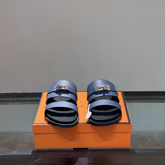 Hermes Jackson Sandals front view in blue Front view of the blue Hermes Jackson Sandals displaying the double straps and metal hardware