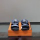 Hermes Jackson Sandals front view in blue Front view of the blue Hermes Jackson Sandals displaying the double straps and metal hardware