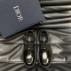 Dior Men's Black Polished Leather Derby Shoes Front Angle Front overhead view of Dior men's black polished leather derby shoes next to a designer box