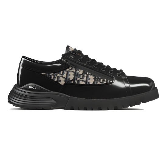 Side Profile of Dior Men's Black and Beige Derby Shoe Side profile view of Dior men's black polished calfskin derby shoe featuring beige and black jacquard panels