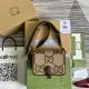 Men's Complete Presentation View with Packaging and Accessories Men's Flat lay showing the brown jumbo GG canvas shoulder bag alongside its packaging, boxes, and documentation