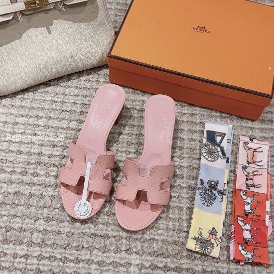 Hermes Oasis Sandals In Light Violet - Top-Down Flat Lay in violet and white Top-down view of light violet Hermes Oasis sandals accompanied by patterned silk twill ribbons and box in violet and white