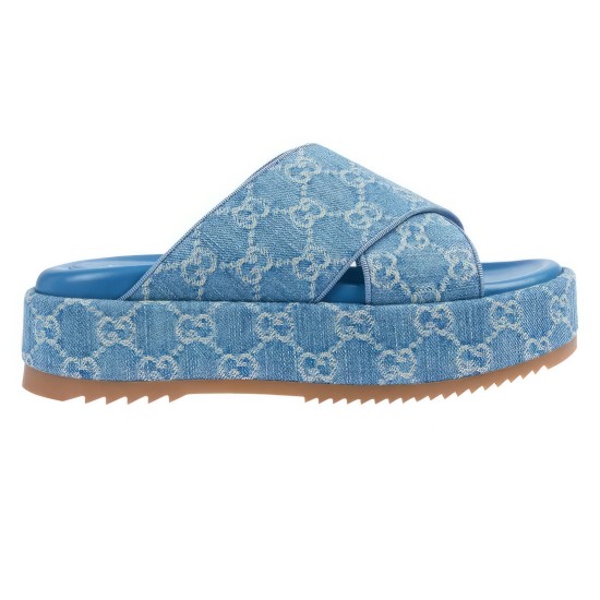 Side view of Gucci blue denim platform slide sandals Side profile of Gucci blue denim platform slide sandals showing thick sole