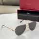 Cartier men's gold metal sunglasses side profile view displaying frame temples and case