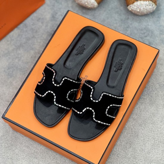 Hermes Oran Black Suede Crystal Sandals Angled View Angled top view of the black slip-on sandals highlighting the crystal-accented cut-out strap details